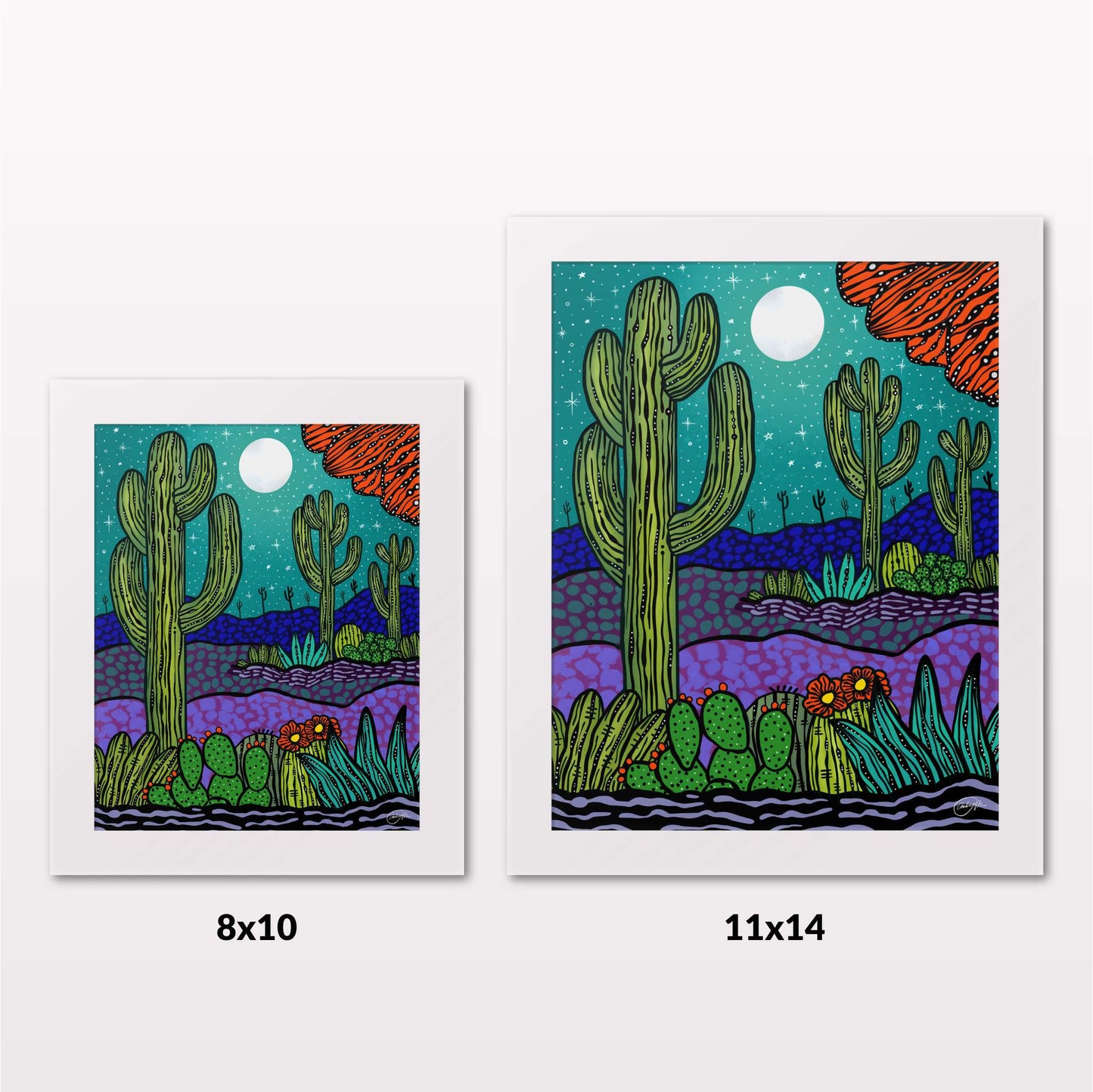 Comparing 8x10 and 11x14 framed art prints on a white wall
