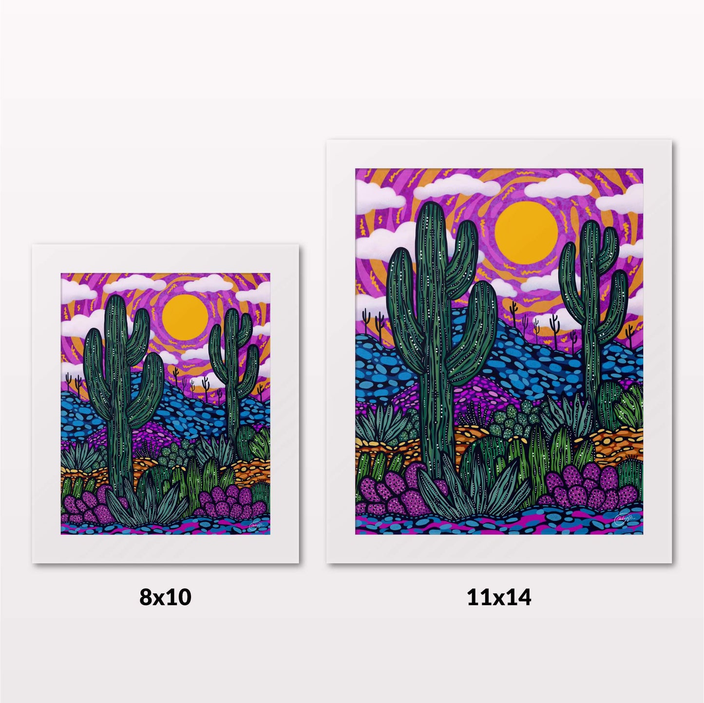 Comparing 8x10 and 11x14 framed art prints on a white wall