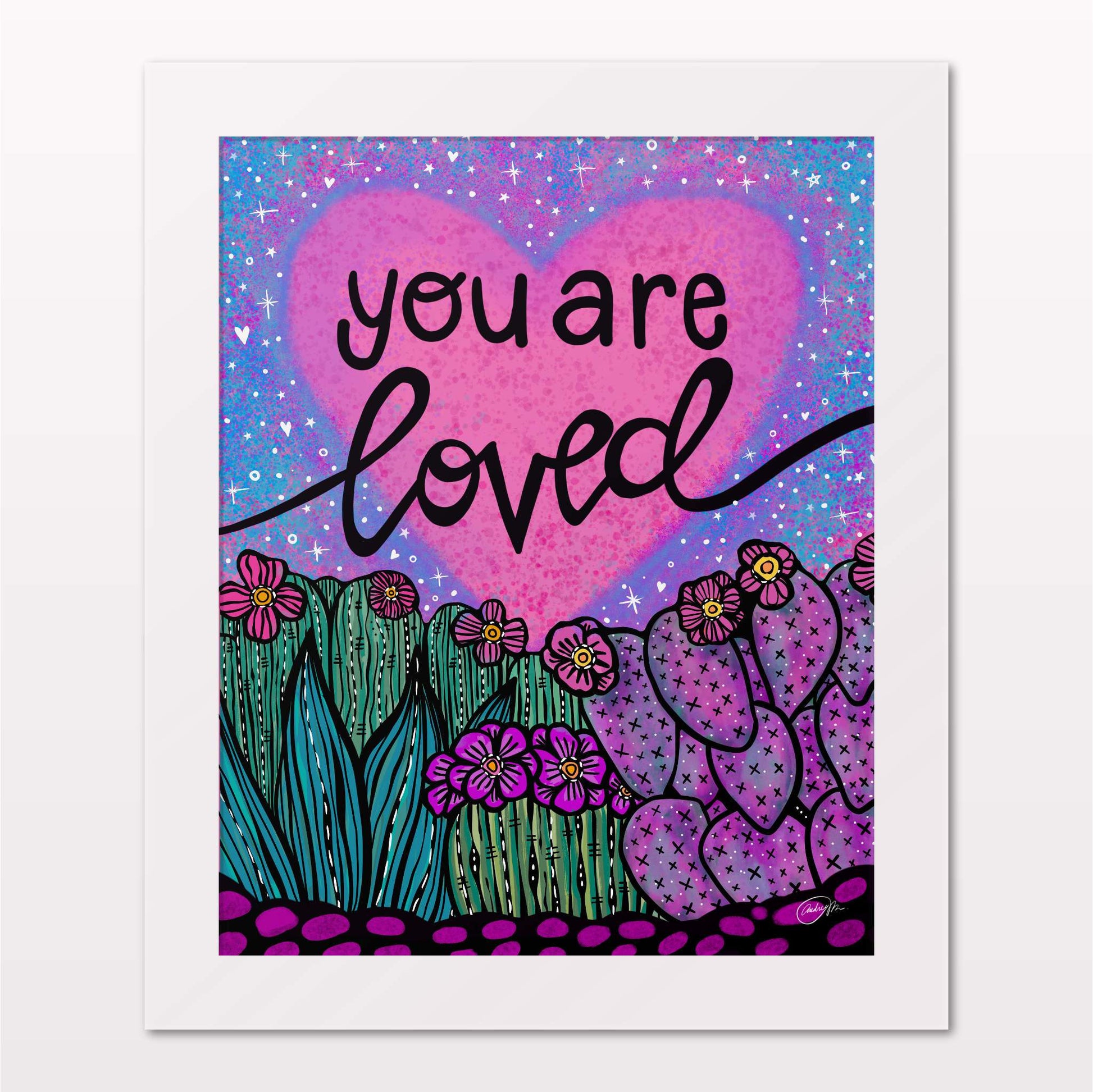 Art print in white frame on white wall