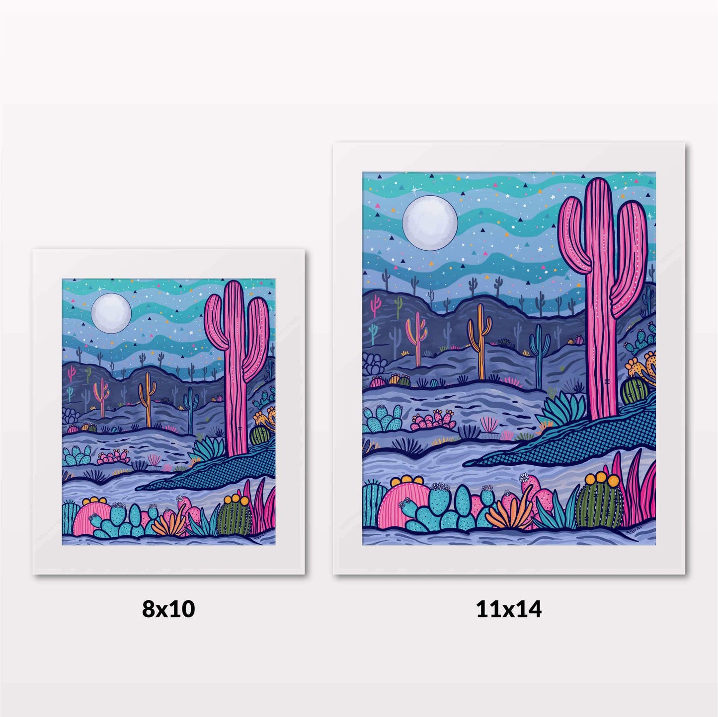 Comparing 8x10 and 11x14 framed art prints on a white wall