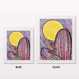 Comparing 8x10 and 11x14 framed art prints on a white wall