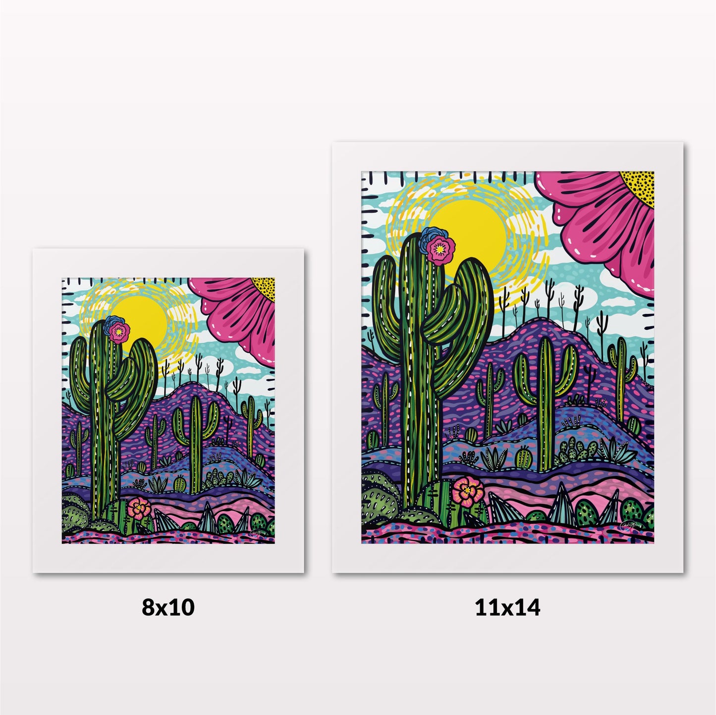 Comparing 8x10 and 11x14 framed art prints on a white wall