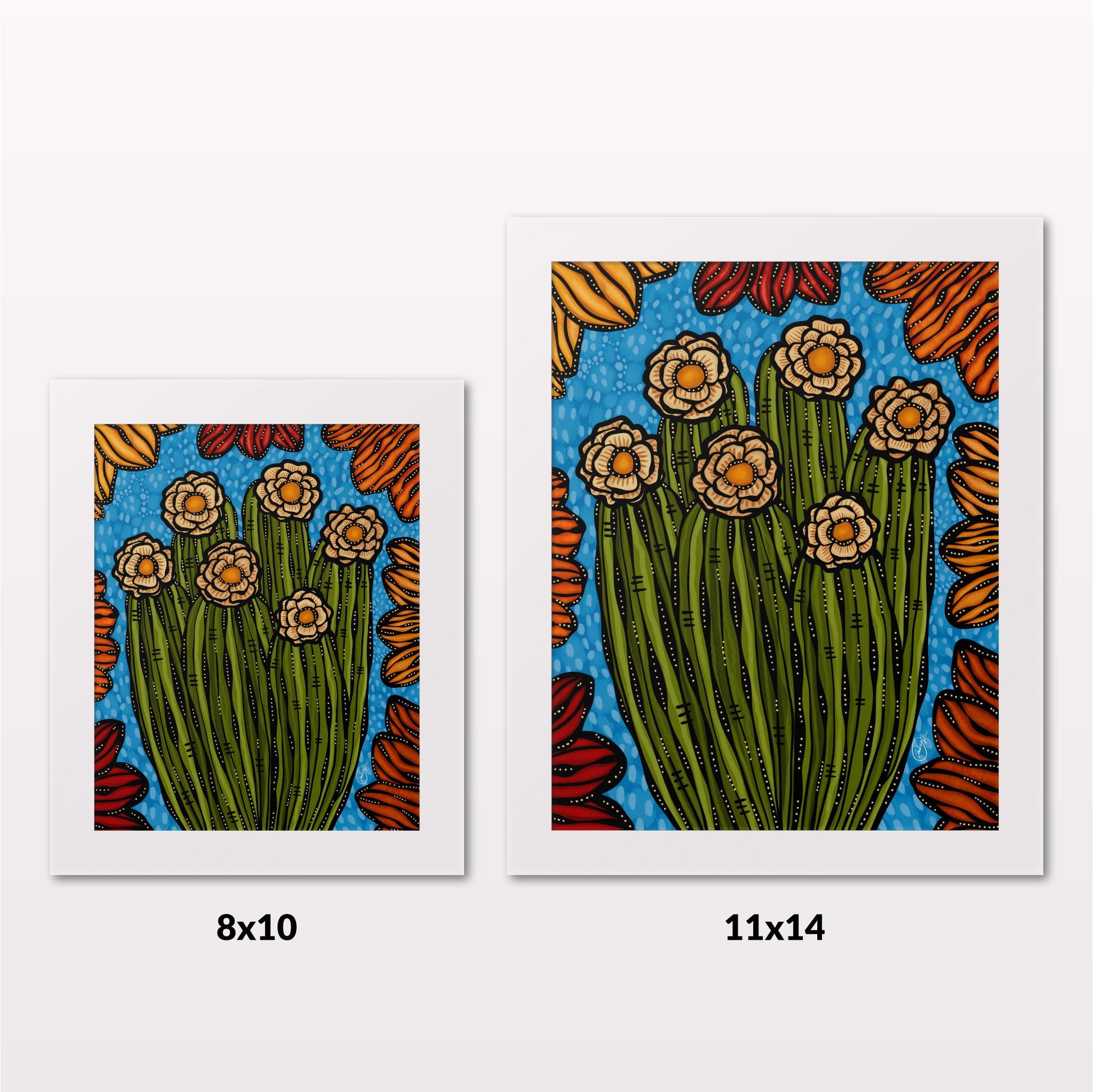Comparing 8x10 and 11x14 framed art prints on a white wall