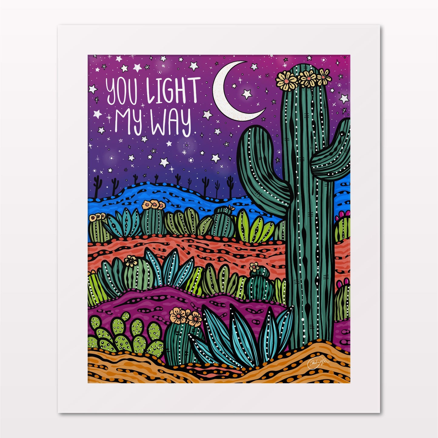 Art print in white frame on white wall