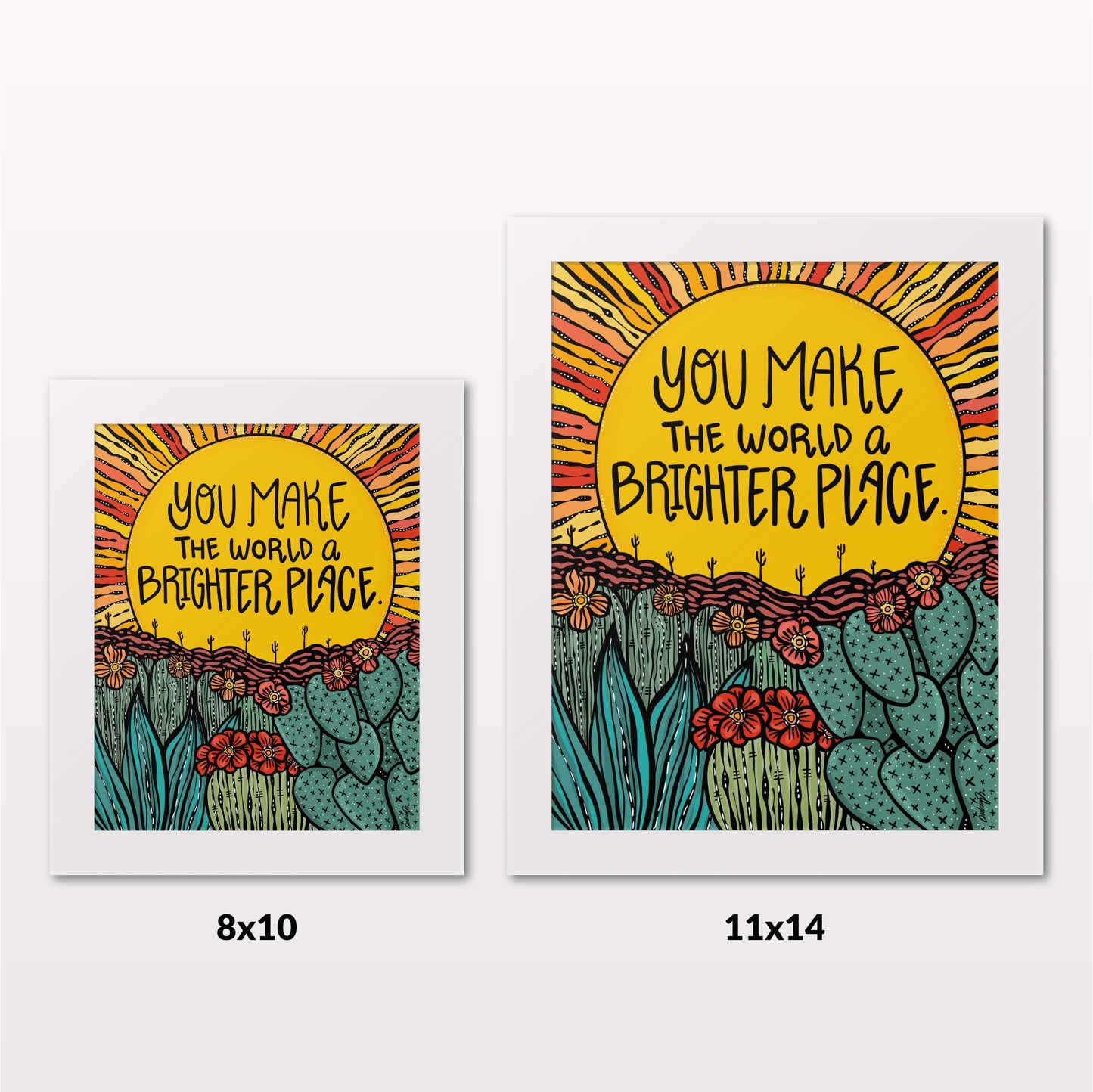 Comparing 8x10 and 11x14 framed art prints on a white wall